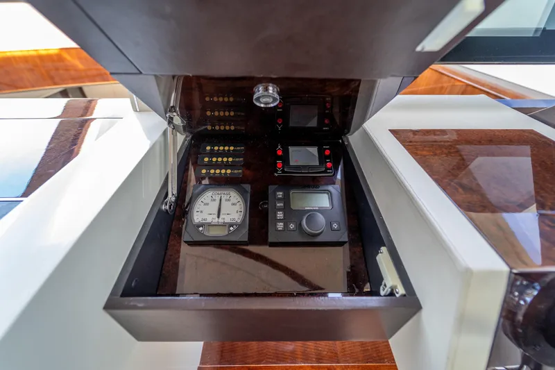 The Office Yacht Photos Pics Control panel of 2009 Lazzara LSX 75 yacht with navigation instruments and compass.