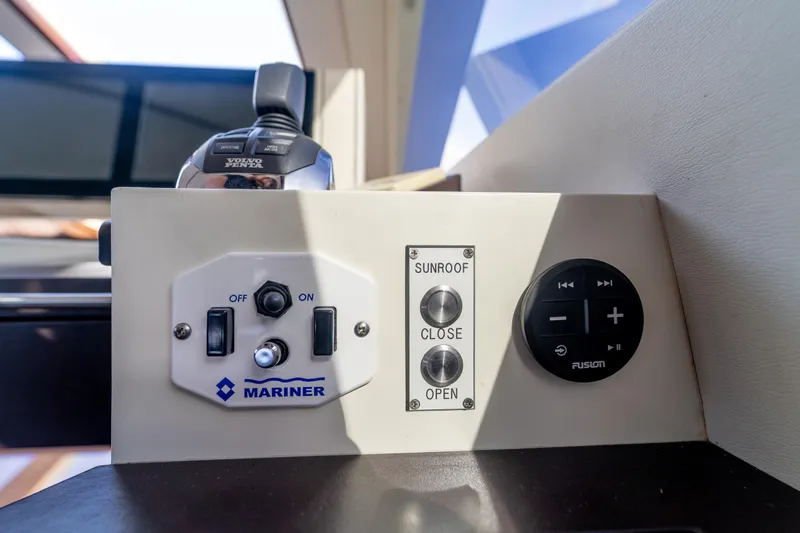 The Office Yacht Photos Pics Control panel on 2009 Lazzara LSX 75 yacht with sunroof and audio controls.