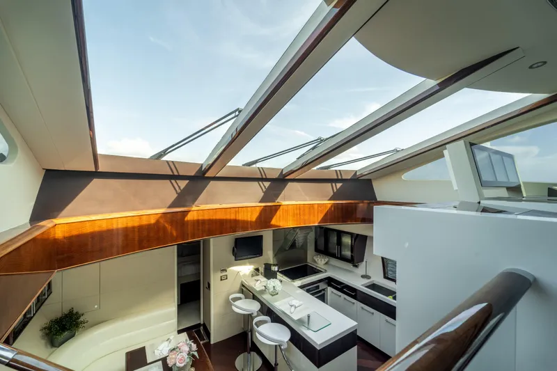 The Office Yacht Photos Pics Luxurious interior of 2009 Lazzara LSX 75 yacht with modern kitchen and skylight.