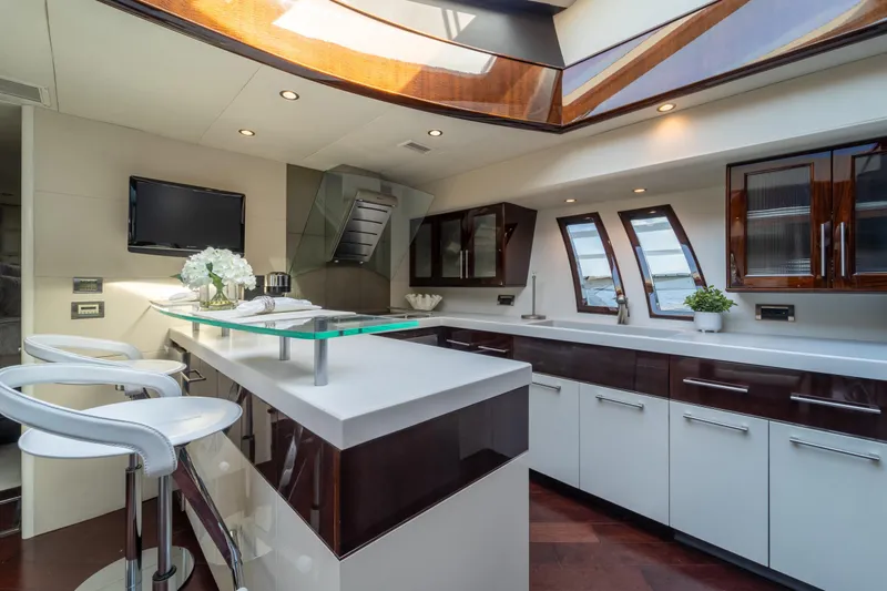The Office Yacht Photos Pics Luxurious kitchen interior of 2009 Lazzara LSX 75 yacht with modern design and elegant finishes.