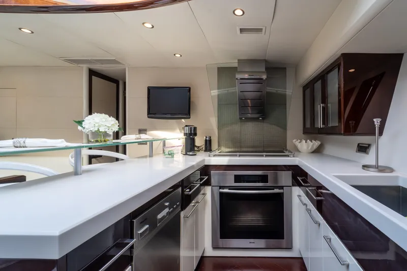 The Office Yacht Photos Pics Luxurious kitchen interior of 2009 Lazzara LSX 75 yacht with modern appliances and sleek design.