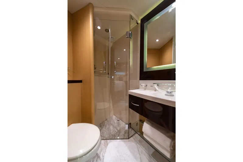 The Office Yacht Photos Pics Luxurious bathroom in 2009 Lazzara LSX 75 yacht with modern fixtures and glass shower.