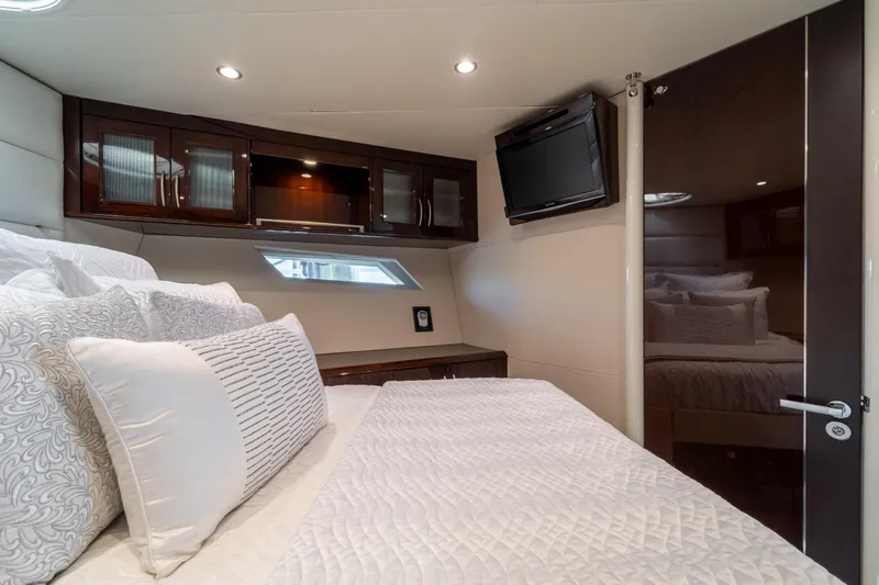 The Office Yacht Photos Pics Luxurious bedroom interior of 2009 Lazzara LSX 75 yacht with elegant bedding and modern decor.