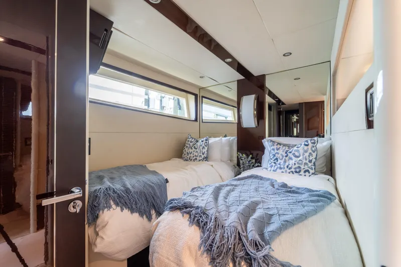 The Office Yacht Photos Pics Luxurious twin bedroom in 2009 Lazzara LSX 75 yacht with elegant decor and natural light.
