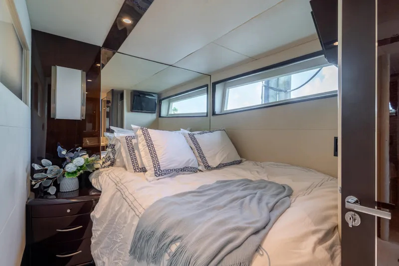 The Office Yacht Photos Pics Luxurious bedroom interior of 2009 Lazzara LSX 75 yacht with elegant bedding and decor.