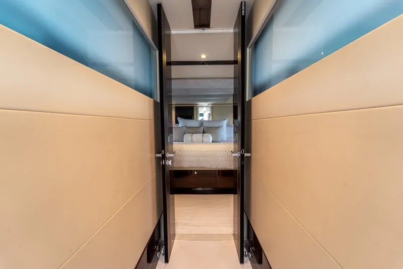 The Office Yacht Photos Pics Interior view of 2009 Lazzara LSX 75 yacht, featuring a luxurious bedroom entrance.