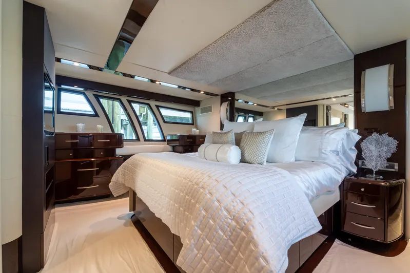 The Office Yacht Photos Pics Luxurious bedroom interior of 2009 Lazzara LSX 75 yacht with elegant bedding and modern design.