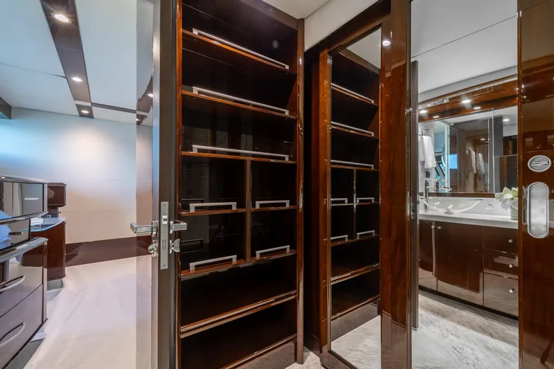 The Office Yacht Photos Pics Luxurious interior of 2009 Lazzara LSX 75 yacht featuring elegant wood cabinetry and modern bathroom.