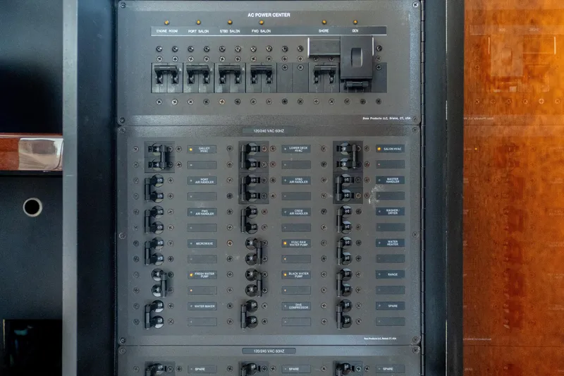 The Office Yacht Photos Pics Electrical control panel on 2009 Lazzara LSX 75 yacht, featuring various switches and breakers.