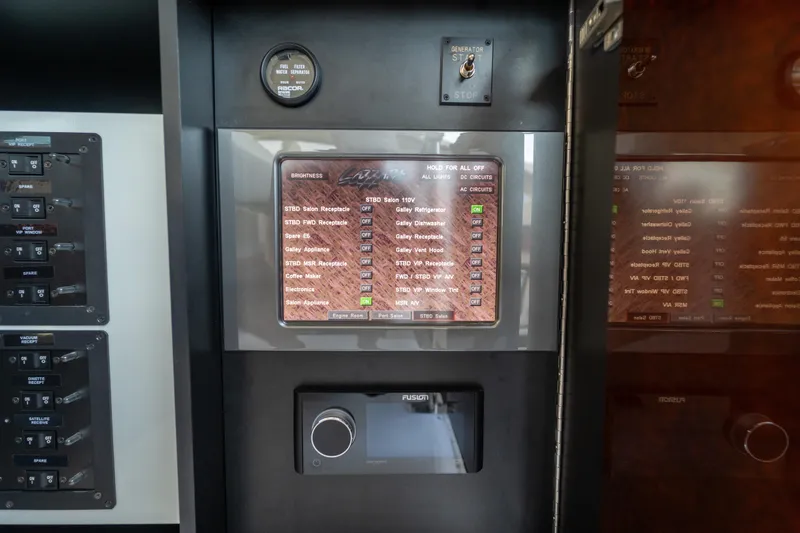 The Office Yacht Photos Pics Control panel of a 2009 Lazzara LSX 75 yacht with various switches and displays.