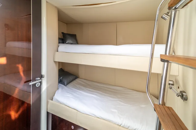 The Office Yacht Photos Pics 2009 Lazzara LSX 75 yacht interior with cozy bunk beds and modern design.