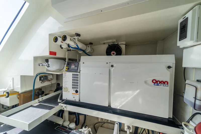 The Office Yacht Photos Pics Engine room of 2009 Lazzara LSX 75 yacht featuring Onan generator and equipment.