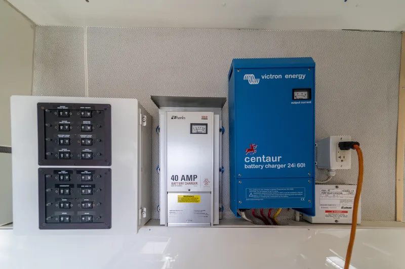 The Office Yacht Photos Pics Electrical panel and battery chargers on a 2009 Lazzara LSX 75 yacht.