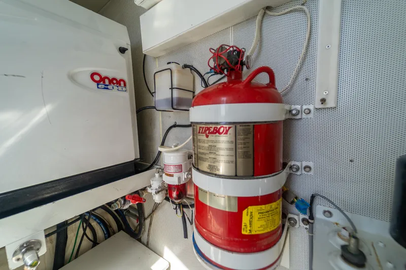 The Office Yacht Photos Pics Engine room of 2009 Lazzara LSX 75 yacht with fire extinguisher and Onan generator.