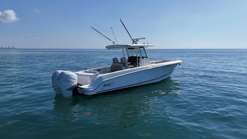  Yacht Photos Pics 2017 Boston Whaler 330 Outrage boat on calm ocean waters.