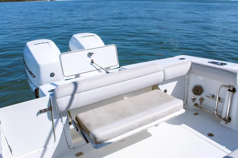  Yacht Photos Pics 2017 Boston Whaler 330 Outrage boat with twin Mercury engines on calm water.