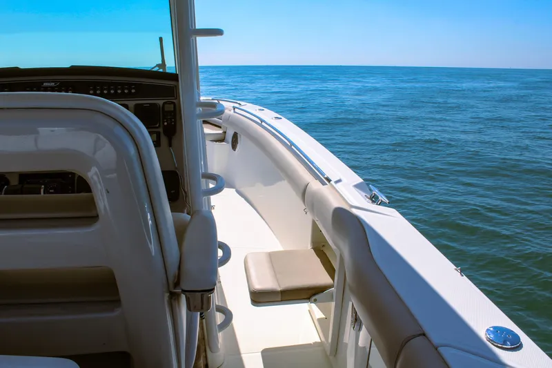  Yacht Photos Pics 2017 Boston Whaler 330 Outrage boat interior with ocean view.
