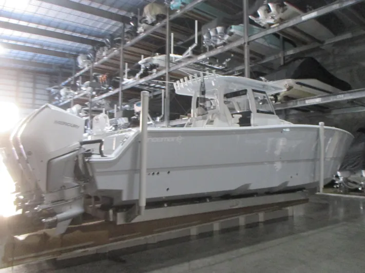  Yacht Photos Pics Freeman 38 boat in storage, 2025 model, with dual outboard motors.