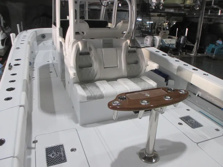  Yacht Photos Pics Luxurious 2025 Freeman 38 boat interior with seating and fishing rod holders.