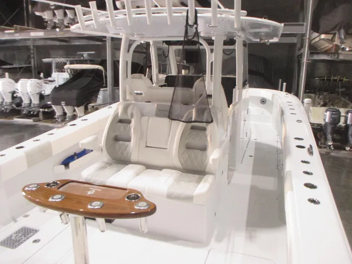  Yacht Photos Pics 2025 Freeman 38 boat interior with seating and fishing rod holders.