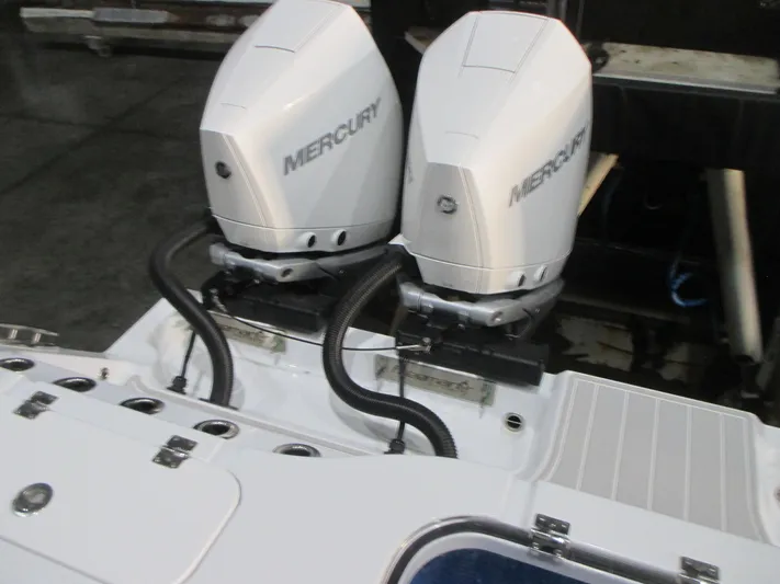  Yacht Photos Pics Twin Mercury outboard engines on a 2025 Freeman 38 boat, docked in a marina.