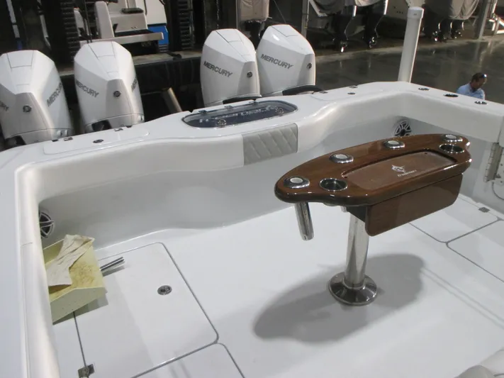  Yacht Photos Pics Freeman 38 boat interior with Mercury engines, featuring a wooden table and white seating, 2025 model.