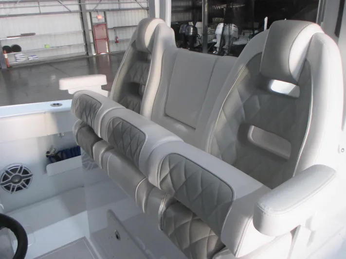  Yacht Photos Pics Luxurious seating in a 2025 Freeman 38 boat, featuring quilted upholstery and ergonomic design.