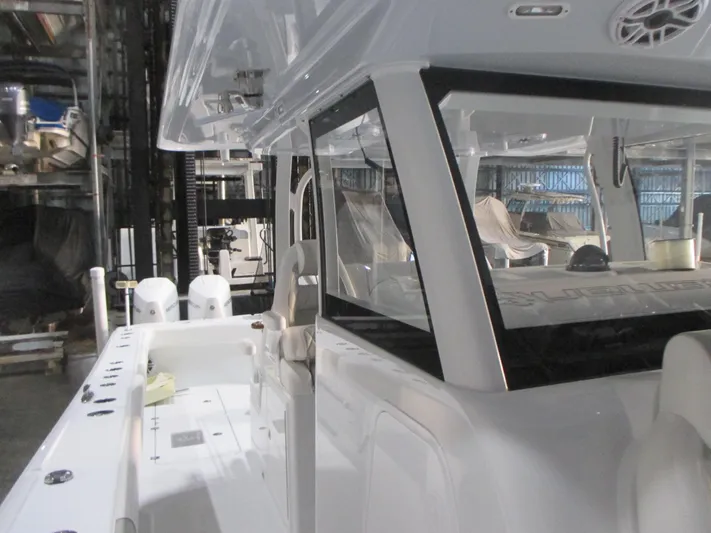  Yacht Photos Pics 2025 Freeman 38 boat interior with modern design and dual engines in a marina setting.