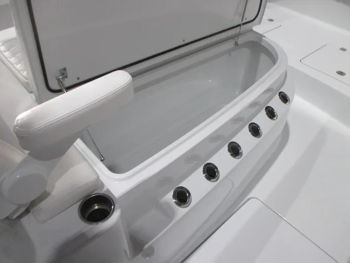  Yacht Photos Pics Freeman 38 boat interior, 2025 model, featuring a sleek storage compartment with cup holders.