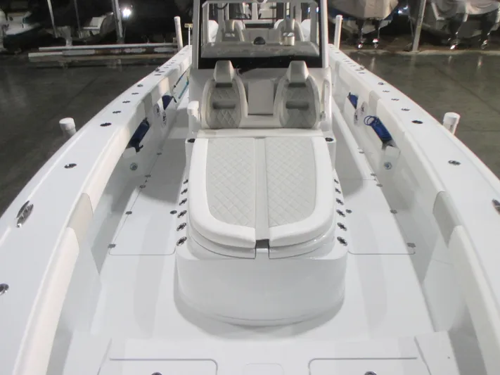  Yacht Photos Pics 2025 Freeman 38 boat interior with white seating and modern design.