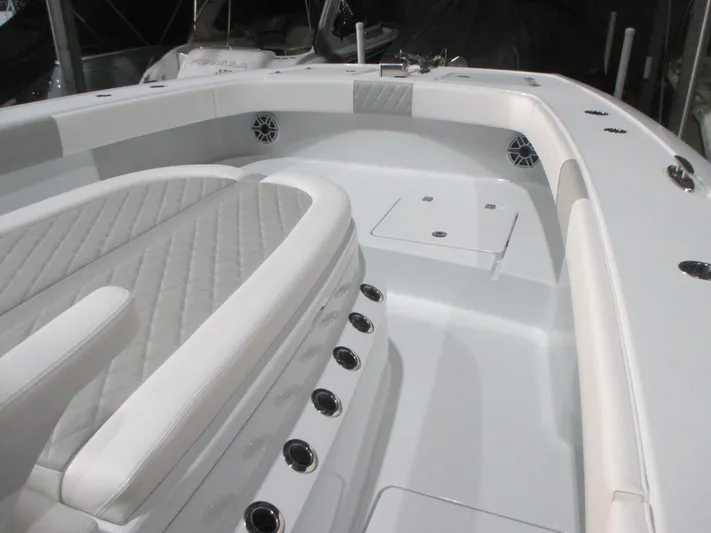  Yacht Photos Pics Luxurious interior of a 2025 Freeman 38 boat with white seating and modern design.