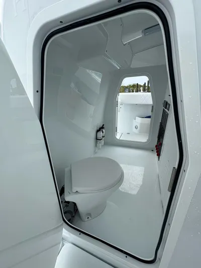  Yacht Photos Pics Freeman 38 boat interior bathroom with modern white design, 2025 model.