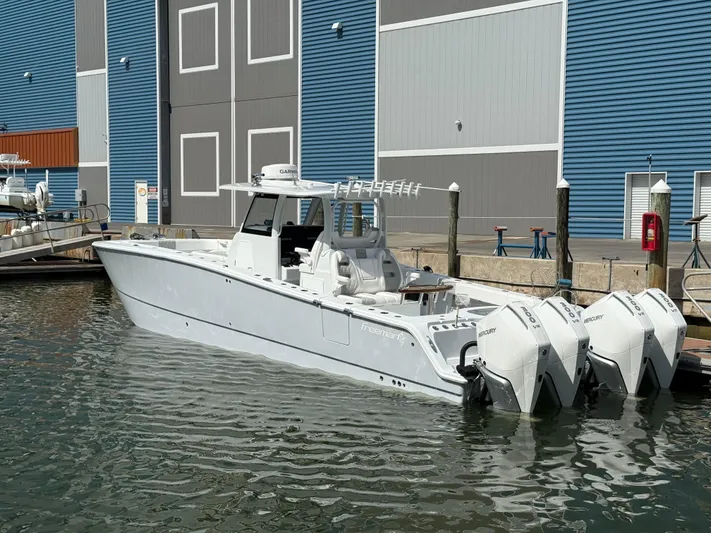  Yacht Photos Pics 2025 Freeman 38 boat docked, featuring four powerful Mercury outboard engines.