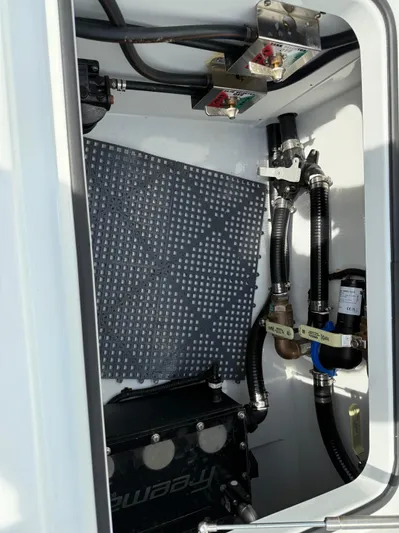  Yacht Photos Pics Freeman 38 boat compartment with wiring and hoses, 2025 model.