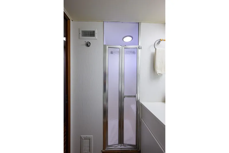 Phantom Yacht Photos Pics Shower area in 1987 Hatteras 63 Motor Yacht with frosted glass door.