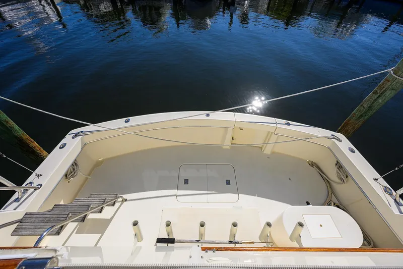Phantom Yacht Photos Pics 1987 Hatteras 63 Motor Yacht deck with water reflection and mooring posts.