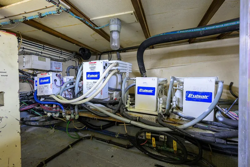 Phantom Yacht Photos Pics Engine room of 1987 Hatteras 63 Motor Yacht with Cruisair systems and wiring.