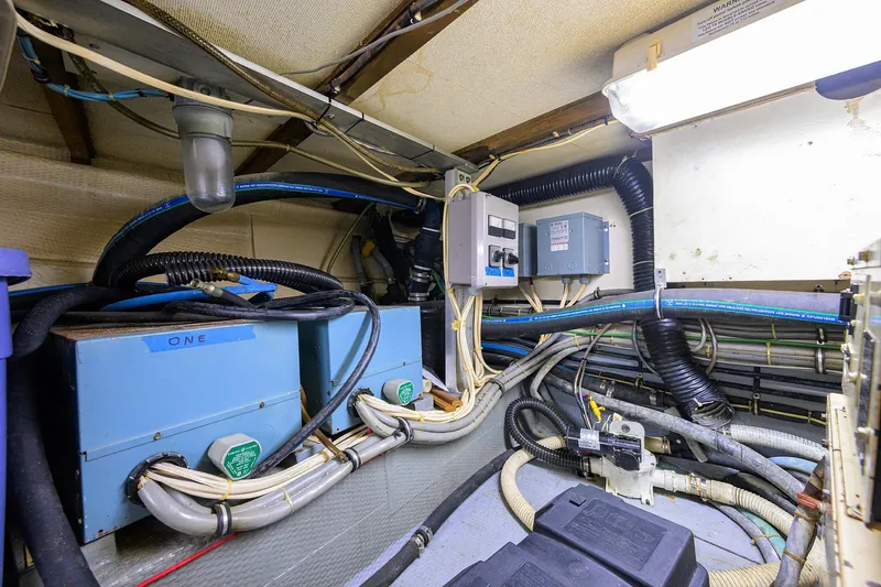 Phantom Yacht Photos Pics Engine room of 1987 Hatteras 63 Motor Yacht with electrical systems and wiring.
