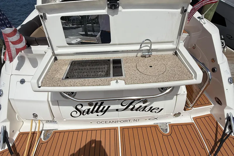  Yacht Photos Pics 2015 Sea Ray 350 Sundancer boat with outdoor kitchen and "Salty Kisses" name.