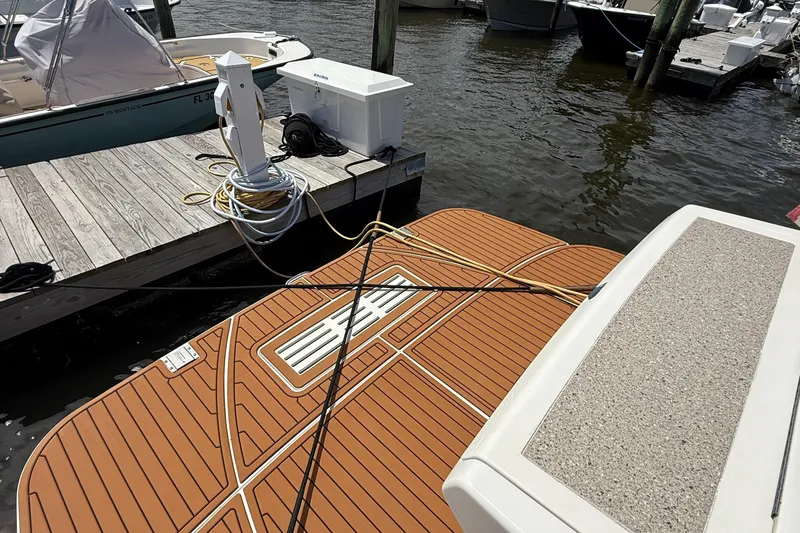  Yacht Photos Pics 2015 Sea Ray 350 Sundancer docked, showing swim platform and marina setup.