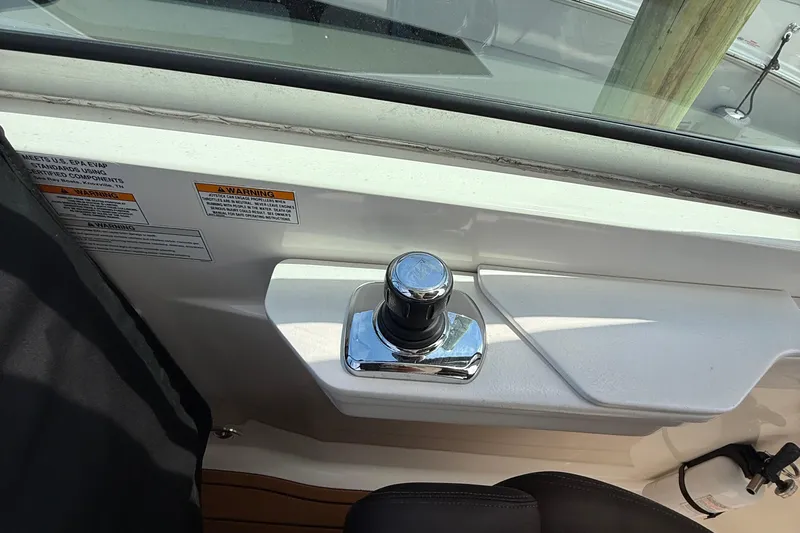  Yacht Photos Pics 2015 Sea Ray 350 Sundancer boat control panel with joystick and warning labels.