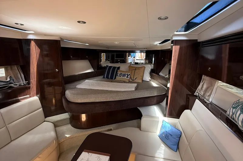 Yacht Photos Pics Luxurious interior of 2015 Sea Ray 350 Sundancer yacht with elegant seating and bedding.