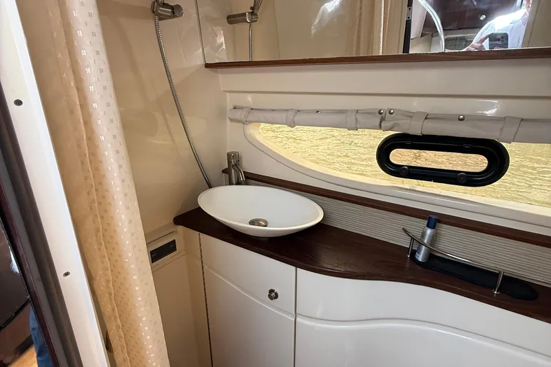  Yacht Photos Pics 2015 Sea Ray 350 Sundancer bathroom with modern sink and shower.