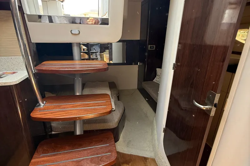  Yacht Photos Pics Interior of 2015 Sea Ray 350 Sundancer with wooden steps and modern design.