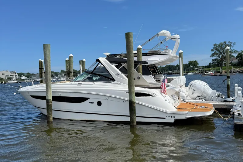  Yacht Photos Pics 2015 Sea Ray 350 Sundancer yacht docked at marina, clear blue sky.
