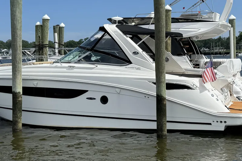  Yacht Photos Pics 2015 Sea Ray 350 Sundancer yacht docked with American flag.