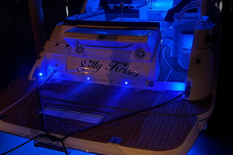  Yacht Photos Pics 2015 Sea Ray 350 Sundancer yacht with blue LED lights at night, named "Salty Kisses."