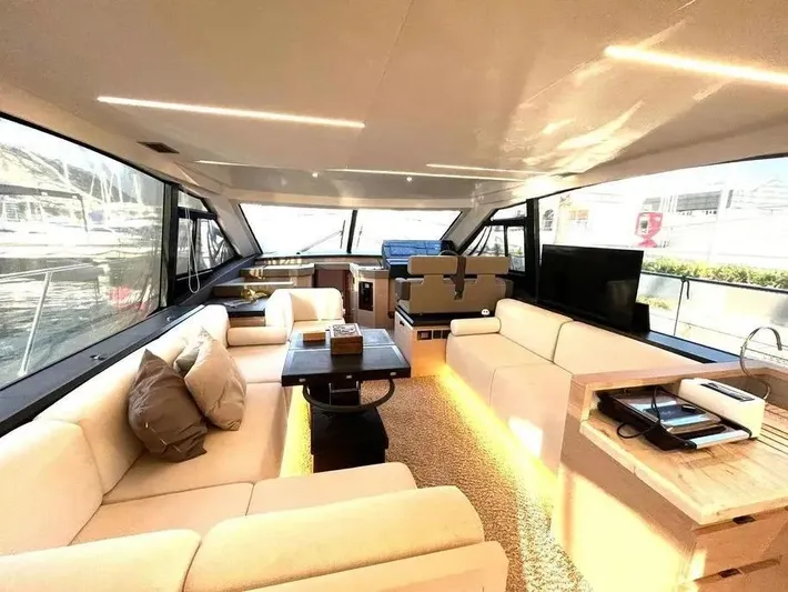 Rialtin Yacht Photos Pics Luxurious interior of 2022 Beneteau Monte Carlo 52 yacht with elegant seating and modern design.