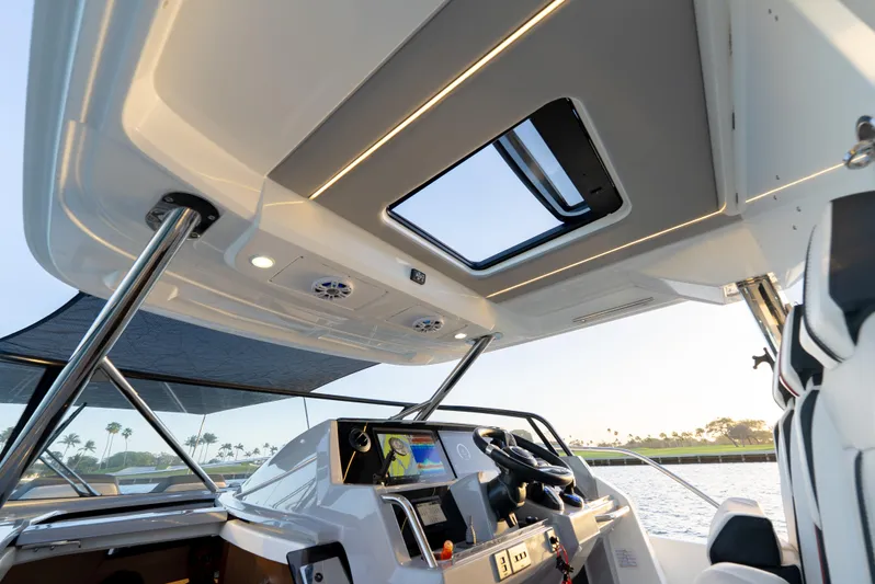  Yacht Photos Pics Interior view of 2022 Jeanneau Leader 12.5 WA boat cockpit with modern controls.