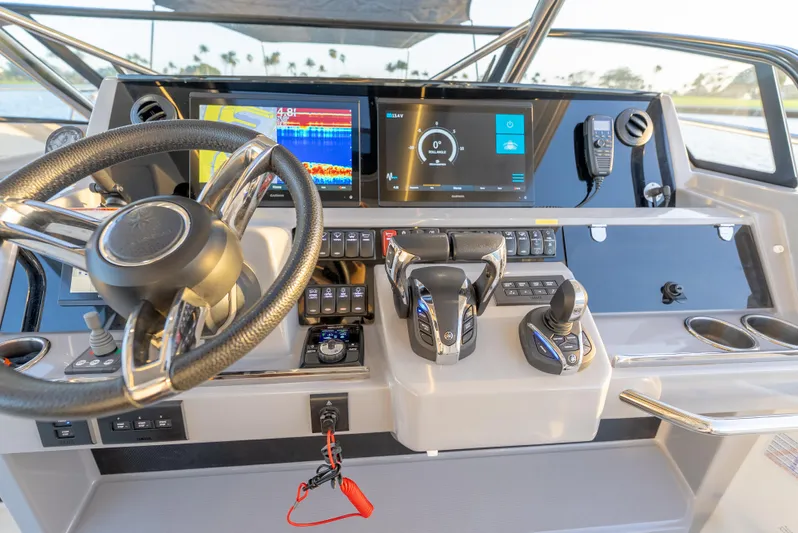  Yacht Photos Pics Cockpit of 2022 Jeanneau Leader 12.5 WA with modern controls and navigation displays.